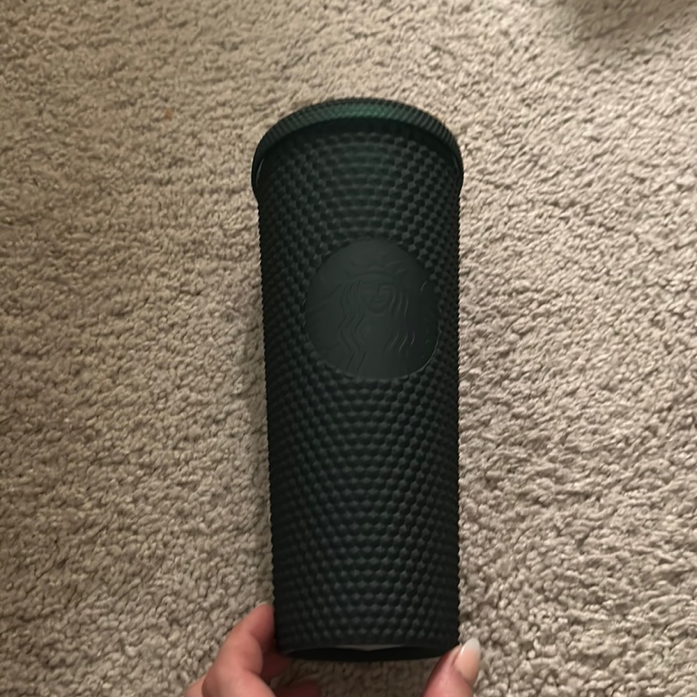 Starbucks Tumbler. It’s a dark green almost looks black